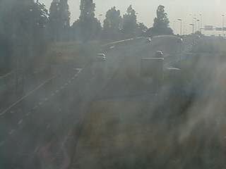 Webcam à proximité de l'A43 à Bron à la jonction entre le Boulevard de l'Université et la rue A.Bouloche. Vue orientée vers la Porte des Alpes