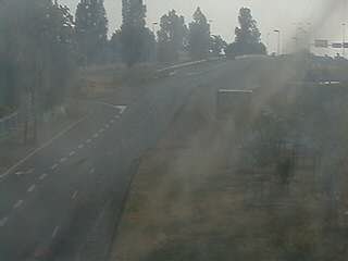 Webcam à proximité de l'A43 à Bron à la jonction entre le Boulevard de l'Université et la rue A.Bouloche. Vue orientée vers la Porte des Alpes